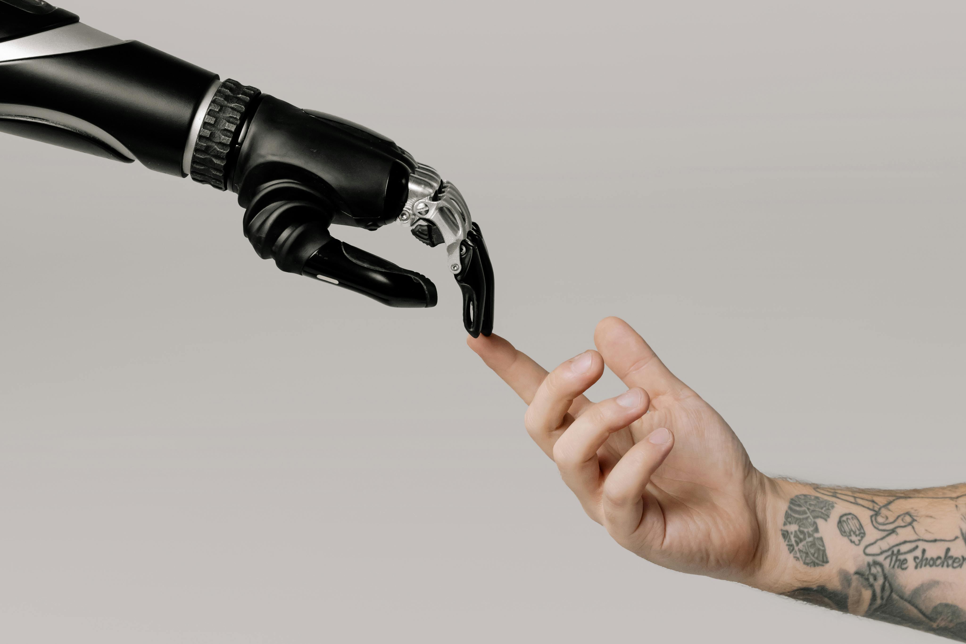 robot hand and human hand touching