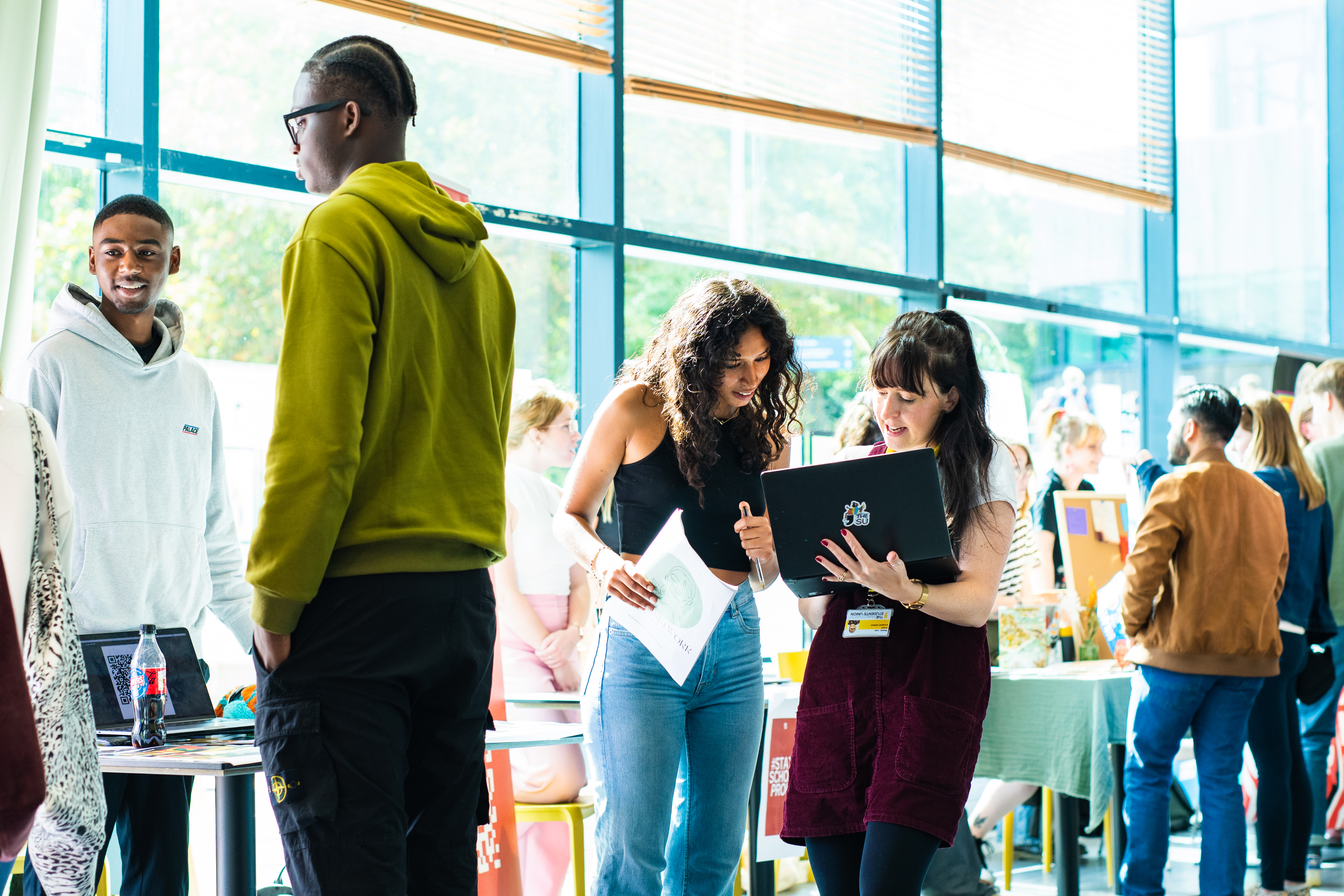 Student talking to member of SU staff.