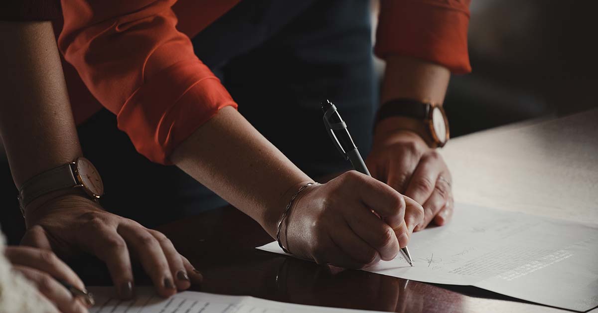A person signing a contract