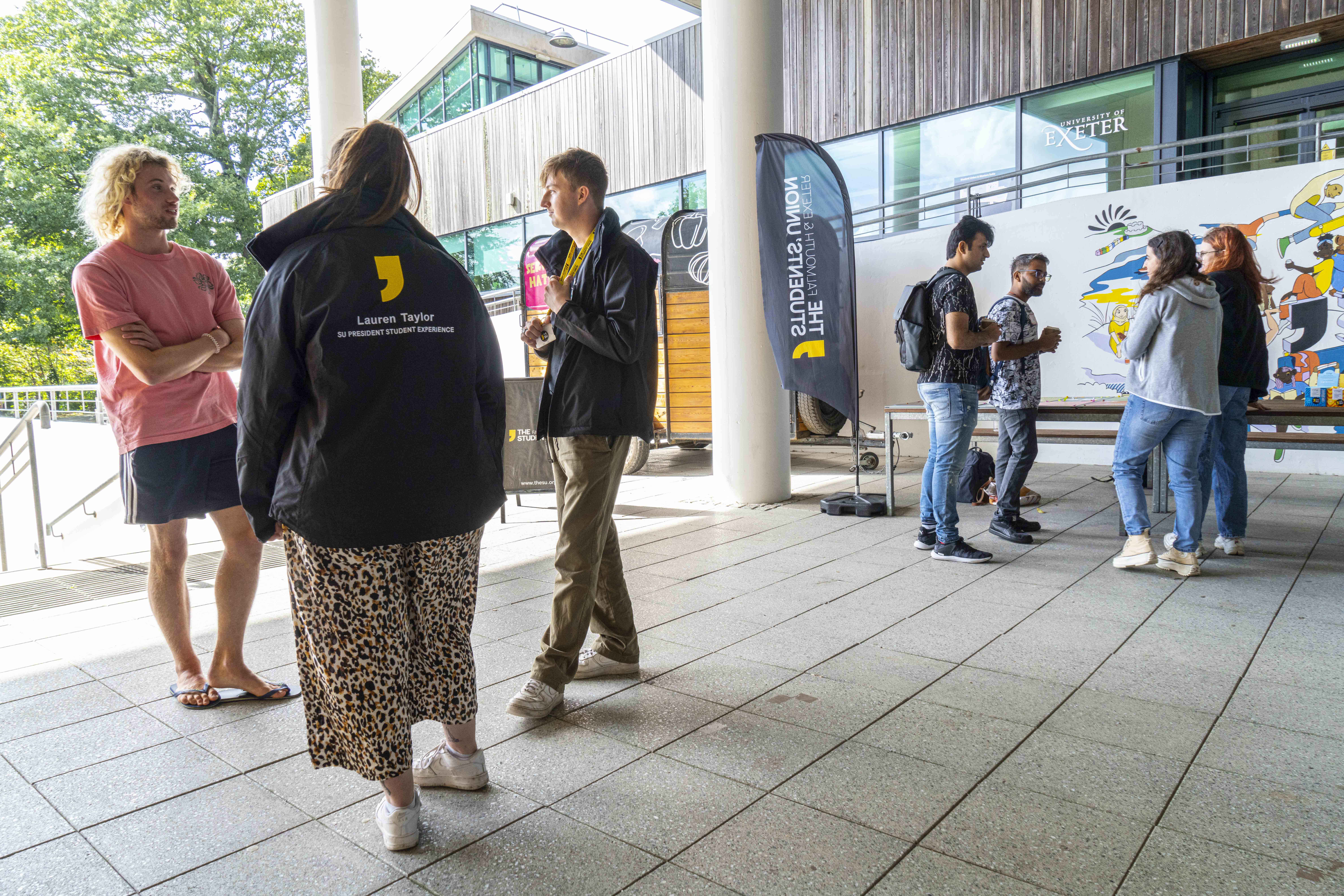 Photo of SU student representatives outside the SU office at Penryn Campus.